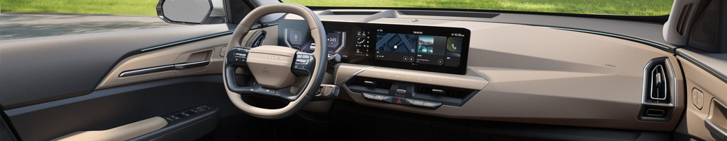 Habitacle du Kia EV5 avec volant, tableau de bord et écran central